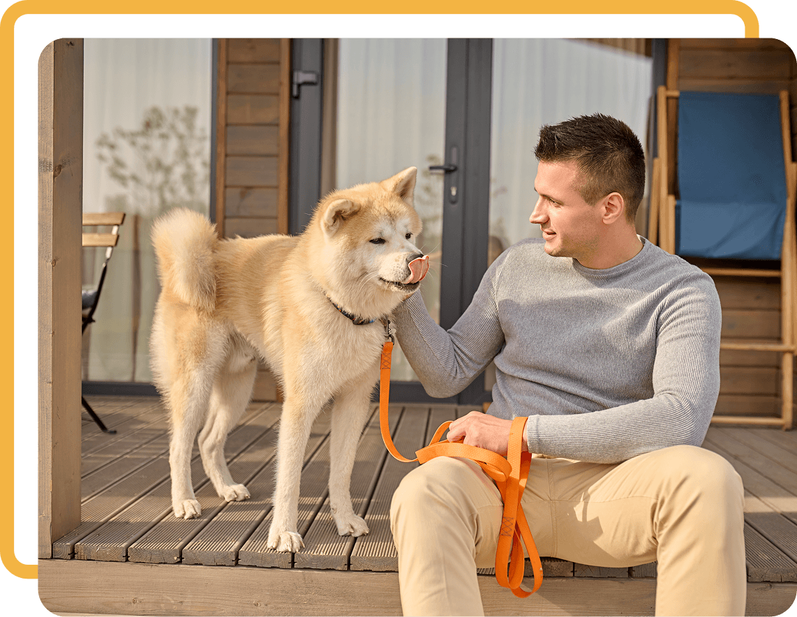 Man with dog in kitchen